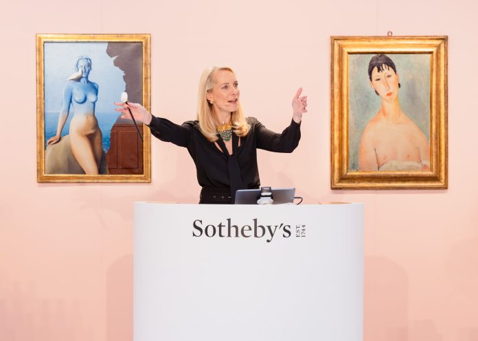 Auctioneer-Aurelie-Vandevoorde-fielding-bids-during-todays-Surrealist-and-Modern-art-sales-wearing-S.jpeg